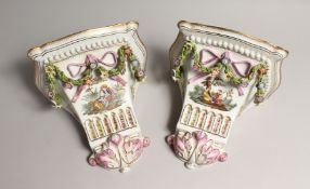 A GOOD PAIR OF MEISSEN STYLE PORCELAIN WALL BRACKETS, hung with garlands 9ins long