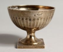 A CIRCULAR RIBBED PEDESTAL SUGAR BOWL on a square base Sheffield 1905, maker T. Bradbury.