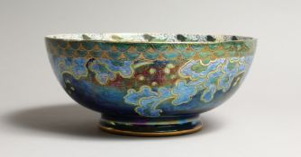 A MALING LUSTREWARE CIRCULAR PORCELAIN BOWL. the centre painted with a sailing ship, at sea. 9.
