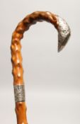 A VICTORIAN RUSTIC WALKING STICK with silver band and tip