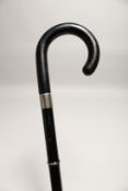 AN UNUSUAL METAL FOLDING WALKING STICK 2ft 6ins long