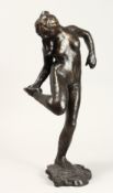AFTER EDGAR DEGAS (1834 - 1917) FRENCH A BRONZE FEMALE FIGURE looking at the sole of her right foot.