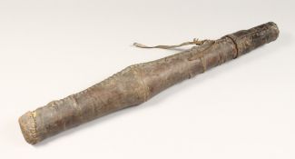 AN AFRICAN LEATHER QUIVER, containing seven steel tipped arrows 27ins long