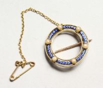 A GOOD ENAMEL AND SEED PEARL BROOCH.