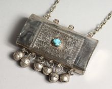 AN ISLAMIC SILVER BOX with bells, stone and chain