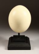 AN OSTRICH EGG on a stand 5.5ins high