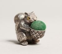 A NOVELTY CAST SILVER SQUIRREL PIN CUSHION.