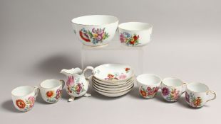 A PART MEISSEN FLORAL SERVICE, comprising five cups, six saucers a jug and two bowls.