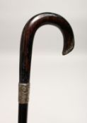 A VICTORIAN WALKING STICK with silver band Birmingham 1874