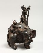 A CHINESE BRONZE GROUP OF TWO CHILDREN WASHING AN ELEPHANT 9ins high.