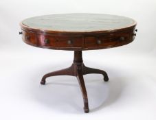 A 19TH CENTURY MAHOGANY AND LEATHER INSET DRUM TABLE with four real and four fake drawers to the