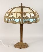 A VERY GOOD 1920'S AMERICAN INFLUENCED TIFFANY TYPE BRONZE AND MOTHER OF PEARL TABLE LAMP AND SHADE.