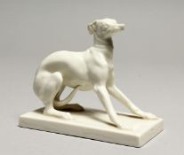 A GOOD NYMPHENBURG WHITE GLAZED PORCELAIN MODEL OF A SEATED UPRIGHT WHIPPET, AFTER P. J. MENE, on