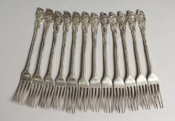 A RARE SET OF TWELVE GEORGE III CAST HESTER BATEMAN DESIGN FORK with cast head finish. London 1782