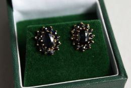 A PAIR OF 9CT GOLD CLUSTER SAPPHIRE EARRINGS