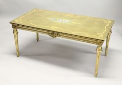 A 20TH CENTURY DECORATIVE GILTWOOD LOW TABLE, with floral painted decoration, on turned tapering