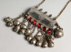 AN ISLAMIC SILVER BOX with bells, coral and chain