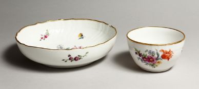 A CONTINENTAL PORCELAIN CIRCULAR DISH 8ins and a bowl 4.5ins diameter painted with flowers.