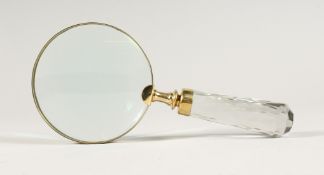 A MAGNIFYING GLASS WITH GLASS HANDLE
