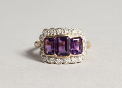 A 9CT GOLD EMERALD CUT AMETHYST AND DIAMOND RING