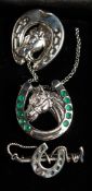 THREE SILVER PIECES OF HORSE RELATED JEWELLERY