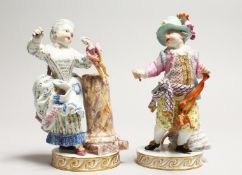 A GOOD PAIR OF MEISSEN PORCELAIN FIGURES a boy holding a hobby horse and a young girl with a doll.