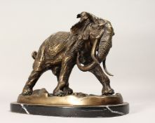 A CONTEMPORARY CAST BRONZE MODEL OF A BULL ELEPHANT on an oval marble base. 11.25ins long.