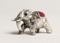 A NOVELTY CAST SILVER ELEPHANT PIN CUSHION.
