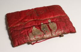 A GEORGIAN RED SILK CUSHION
