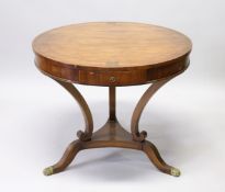 A FRENCH DESIGN ROSEWOOD AND BRASS INLAID CIRCULAR TABLE, the top with a single drawer on three