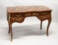 A FRENCH STYLE MARQUETRY INLAID BUREAU PLAT of shaped outline, with an arrangement of five drawers
