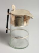 A CHRISTOPHER DRESSER DESIGN GLASS JUG with plated mount and ebony handle. 9ins high.