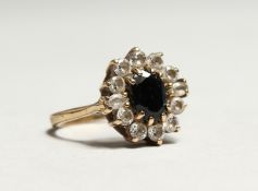 A WHITE GOLD DIAMOND AND SAPPHIRE RING