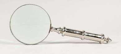 A MAGNIFYING GLASS WITH CHROME HANDLE.