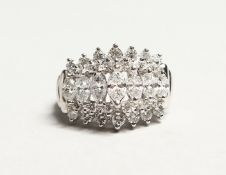 A GOOD 14CT WHITE GOLD FIVE ROW MARQUIS CUT RING set with thirty three diamonds