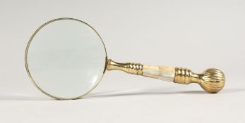 A MAGNIFYING GLASS WITH MOTHER OF PEARL HANDLE.