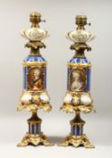 A SUPERB PAIR OF 19TH CENTURY FRENCH PORCELAIN AND GILT BRONZE LAMPS ON STANDS, painted with