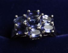 A SILVER AMETHYST CLUSTER RING