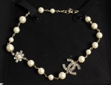 A CHANEL REPLICA GILT AND PEARL NECKLACE in a box