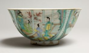 A CHINESE FAMILLE VERTE PORCELAIN BOWL, painted with figures in a landscape. 6.25ins diameter.