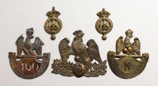 THREE LARGE NAPOLEONIC BRASS BADGES and two small badges. (5)