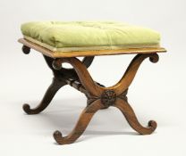 A GOOD 19TH CENTURY ROSEWOOD STOOL with button upholstered overstuffed seat, 'X' shape ends united