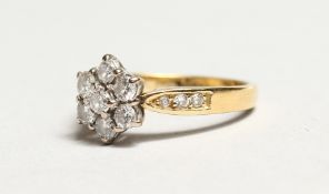 A GOOD 18K WHITE GOLD SEVEN STONE DIAMOND RING.