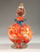 A MURANO MOTTLED ORANGE CLOWN BOTTLE AND STOPPER. 8ins high.