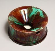 A WEDGWOOD MAJOLICIA SPITOON,brown and green treacle glaze, impressed mark to base 7.25ins