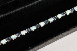 A SILVER OPAL AND SAPPHIRE LINE BRACELET