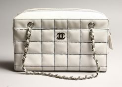A 'CHANEL' WHITE PADDED BAG. used 11.5ins