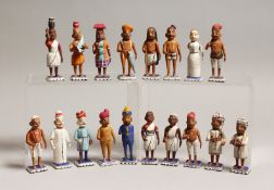 A BOX OF CARVED AND PAINTED INDIAN WOODEN FIGURES, mostly, 3.75ins high.
