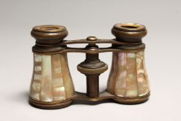 A PAIR OF MOTHER OF PEARL AND GILT OPERA GLASSES 4ins long.
