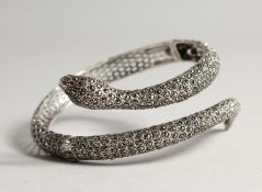 A LARGE SILVER AND MARCASITE RUBY EYE SLAVE BRACELET
